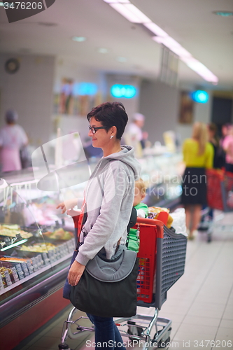 Image of mother with baby in shopping