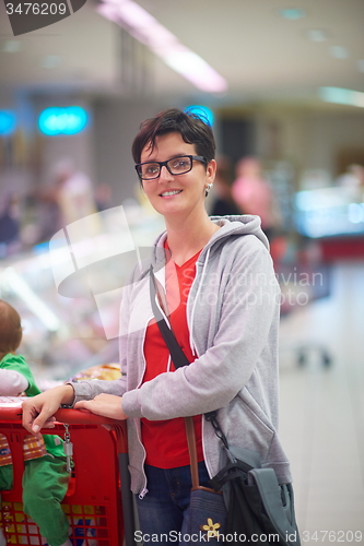 Image of mother with baby in shopping