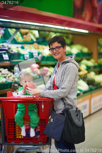 Image of mother with baby in shopping