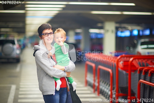 Image of mother with baby in shopping