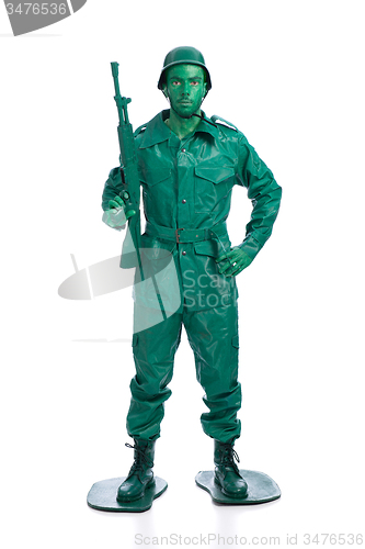 Image of Man on a green toy soldier costume