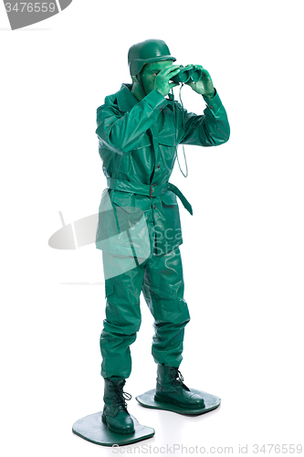 Image of Man on a green toy soldier costume