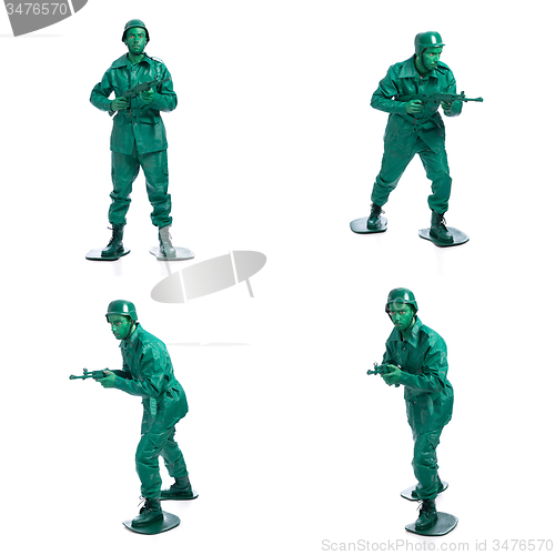 Image of Four man on a green toy soldier costume