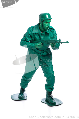 Image of Man on a green toy soldier costume