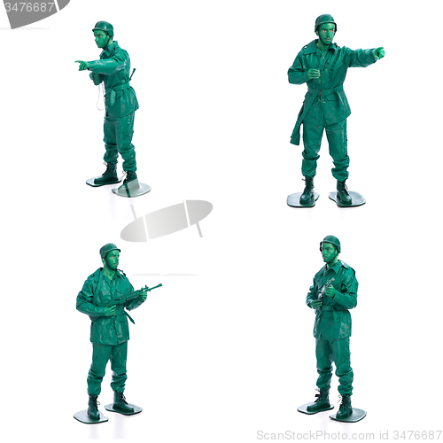 Image of Four man on a green toy soldier costume