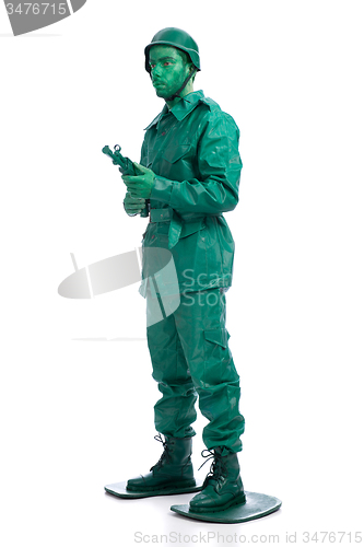 Image of Man on a green toy soldier costume