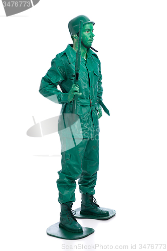 Image of Man on a green toy soldier costume