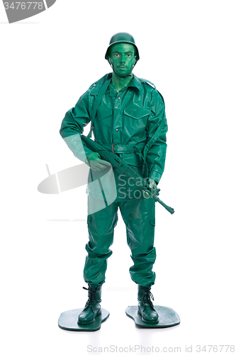 Image of Man on a green toy soldier costume