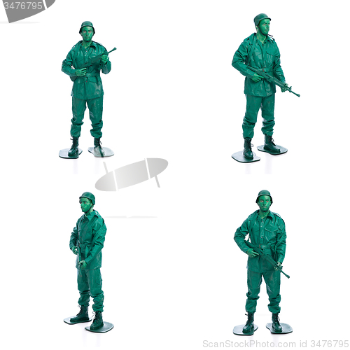 Image of Four man on a green toy soldier costume