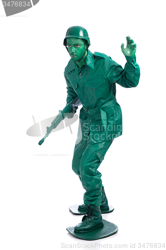 Image of Man on a green toy soldier costume