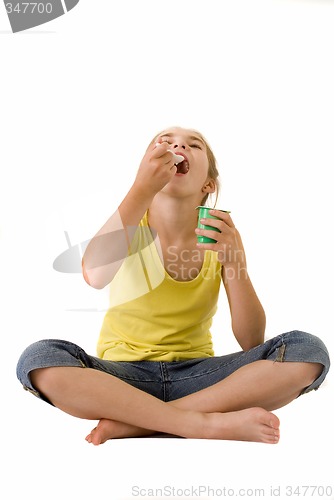 Image of Girl eating yoghurt III