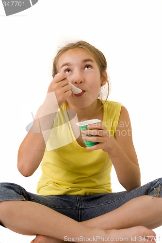 Image of Girl eating yoghurt IV
