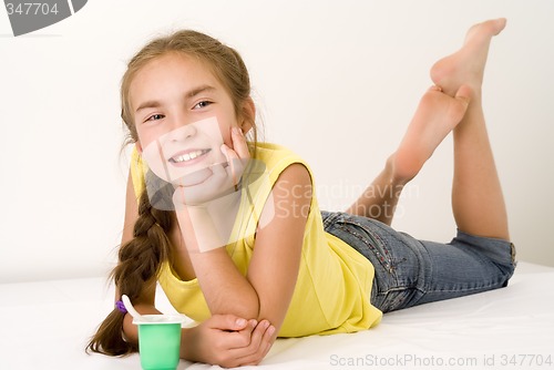 Image of Girl eating yoghurt VII