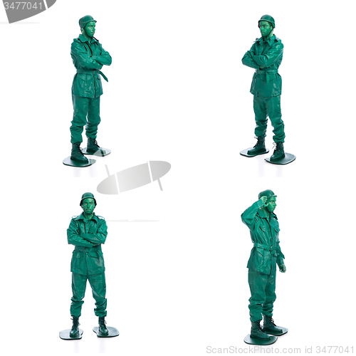 Image of Four man on a green toy soldier costume