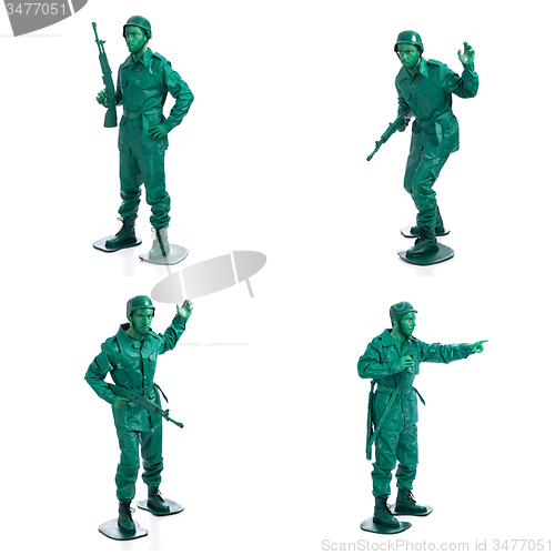 Image of Four man on a green toy soldier costume