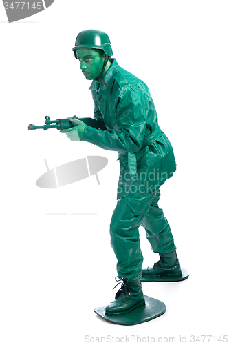 Image of Man on a green toy soldier costume