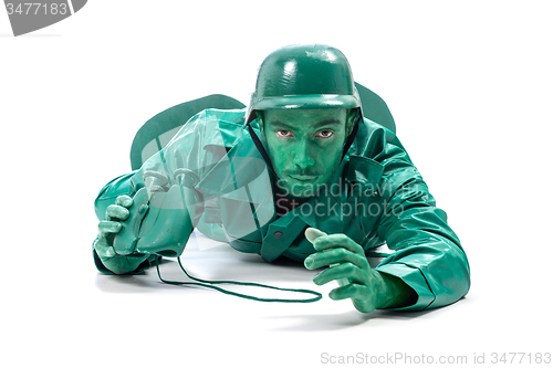 Image of Man on a green toy soldier costume