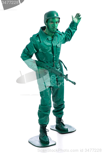 Image of Man on a green toy soldier costume