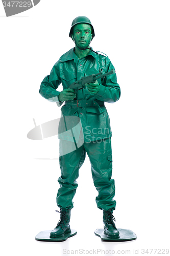 Image of Man on a green toy soldier costume