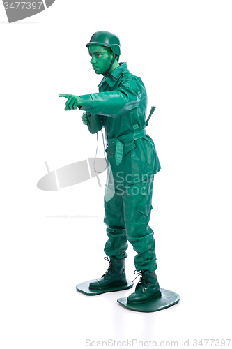 Image of Man on a green toy soldier costume