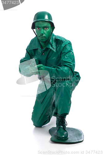 Image of Man on a green toy soldier costume