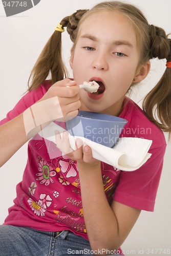 Image of Girl eating porridge III