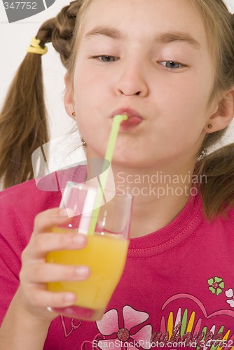 Image of Girl drinking orange juice III