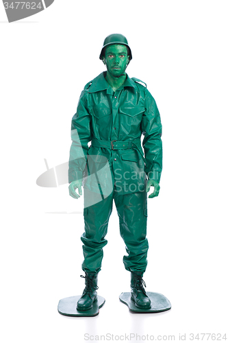 Image of Man on a green toy soldier costume