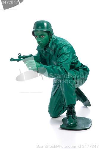 Image of Man on a green toy soldier costume