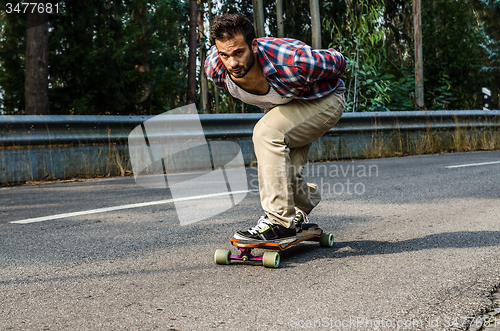 Image of Downhill skateboarder in action