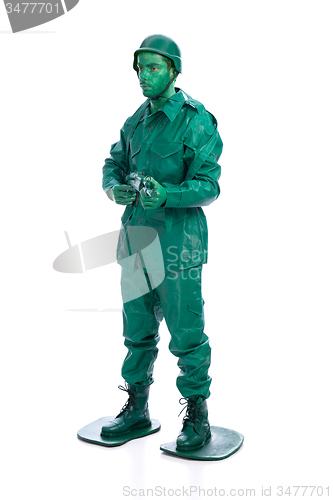 Image of Man on a green toy soldier costume