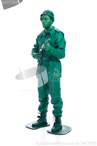 Image of Man on a green toy soldier costume