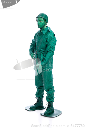 Image of Man on a green toy soldier costume