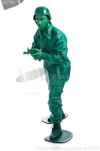 Image of Man on a green toy soldier costume