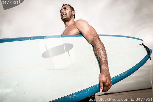 Image of Surfer wathing the waves