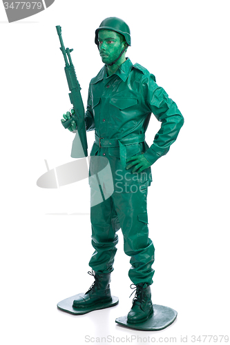 Image of Man on a green toy soldier costume