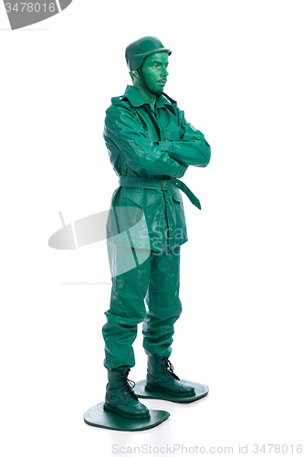 Image of Man on a green toy soldier costume