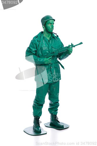 Image of Man on a green toy soldier costume