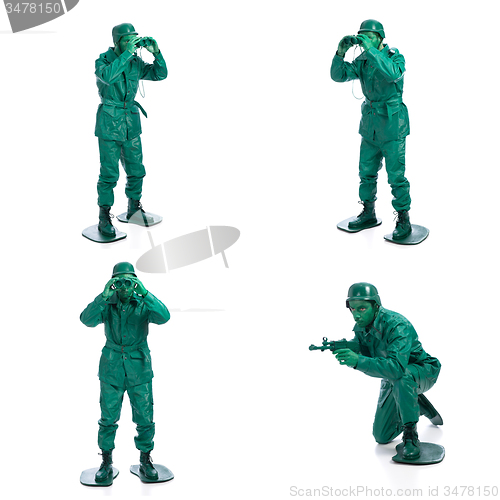 Image of Four man on a green toy soldier costume