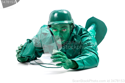 Image of Man on a green toy soldier costume