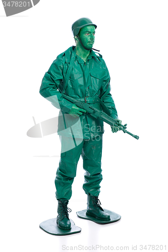 Image of Man on a green toy soldier costume