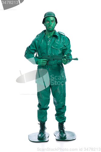 Image of Man on a green toy soldier costume