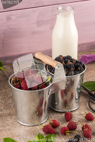 Image of Metal buckets with fresh berries