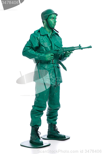 Image of Man on a green toy soldier costume