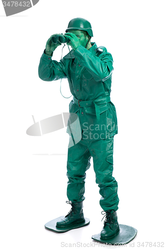 Image of Man on a green toy soldier costume