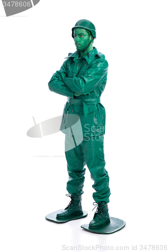 Image of Man on a green toy soldier costume