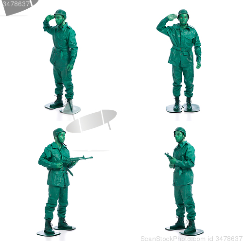 Image of Four man on a green toy soldier costume