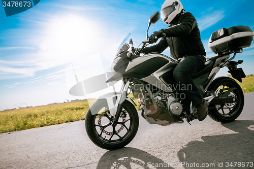 Image of Biker in helmet road motorbike