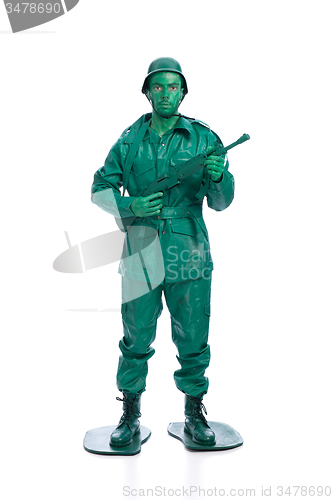 Image of Man on a green toy soldier costume