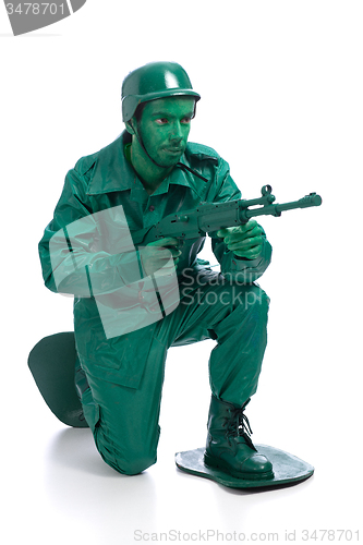 Image of Man on a green toy soldier costume